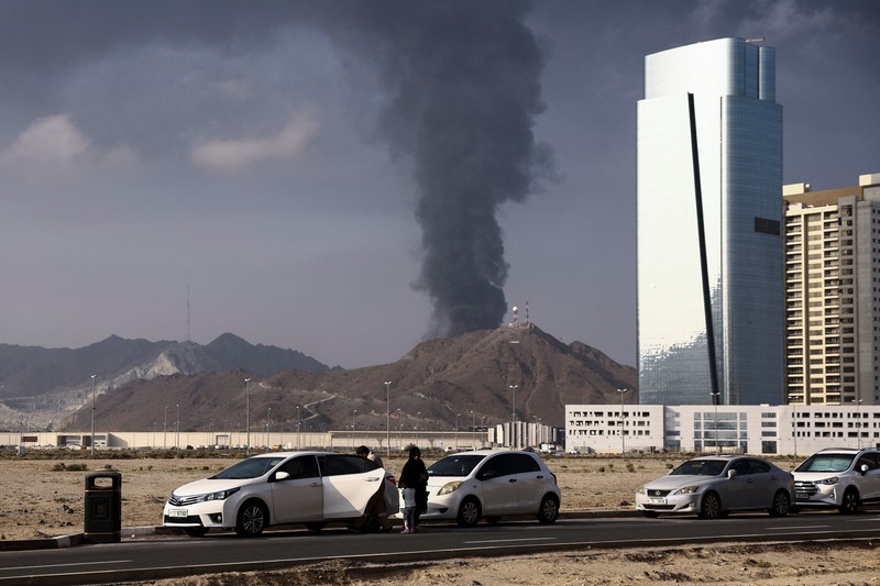 Smoke rises in the Fujairah oil industry zone following a fire caused by debris after interception of a drone by air defenses, according to the Fujairah media office, amid the U.S.-Israel conflict with Iran, in Fujairah, United Arab Emirates, March 3, 2026. REUTERS/Amr Alfiky