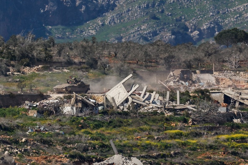 An Israeli tank manouvers in Lebanon, following an escalation between Hezbollah and Israel amid the U.S.-Israeli conflict with Iran, as seen from the Israeli side of the border with Lebanon, March 5, 2026. REUTERS/Ammar Awad