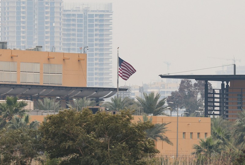 Smoke rises from the U.S. embassy building, after Iraqi security sources said the embassy was hit in a missile attack, in Baghdad, Iraq March 14, 2026 in this screen grab obtained from a social media video. SOCIAL MEDIA/via REUTERS  THIS IMAGE HAS BEEN SUPPLIED BY A THIRD PARTY.  NEWS USE ONLY. NO RESALES. NO ARCHIVES. BEST QUALITY AVAILABLE. VERIFICATION - Reuters was able to confirm the video from the shape and location of buildings and a water body which matched file and satellite imagery of the area. Date was verified by Iraqi security sources and media reports. Multiple corroborating videos showed smoke rising from the building. No older versions of the video were found posted online before March 14