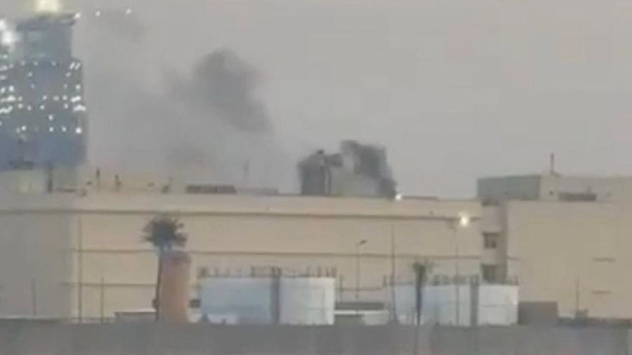 Smoke rises from the U.S. embassy building, after Iraqi security sources said the embassy was hit in a missile attack, in Baghdad, Iraq March 14, 2026 in this screen grab obtained from a social media video. SOCIAL MEDIA/via REUTERS  THIS IMAGE HAS BEEN SUPPLIED BY A THIRD PARTY.  NEWS USE ONLY. NO RESALES. NO ARCHIVES. BEST QUALITY AVAILABLE. VERIFICATION - Reuters was able to confirm the video from the shape and location of buildings and a water body which matched file and satellite imagery of the area. Date was verified by Iraqi security sources and media reports. Multiple corroborating videos showed smoke rising from the building. No older versions of the video were found posted online before March 14