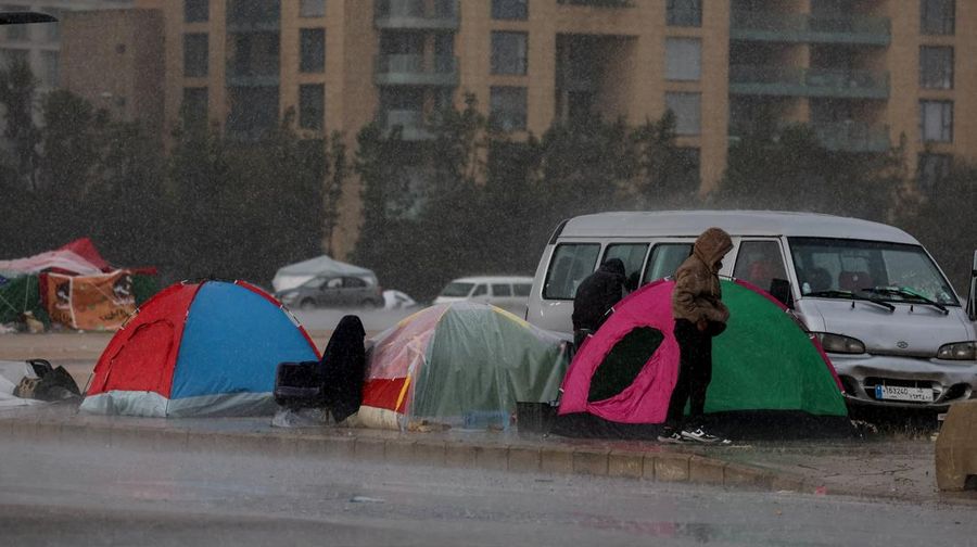Rain falls over tents used by displaced people on a street along the corniche overlooking the sea, following an escalation between Hezbollah and Israel, amid the U.S.-Israeli conflict with Iran, in Beirut, Lebanon, March 15, 2026. REUTERS/Amr Abdallah Dalsh