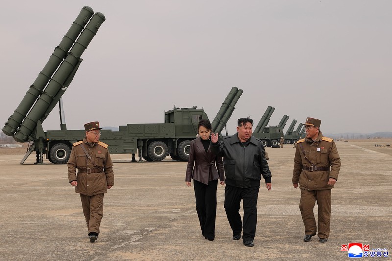 North Korean leader Kim Jong Un, accompanied by his daughter Kim Ju Ae, oversees the test-launch of 600 mm-calibre multiple rocket launchers, North Korea, March 14, 2026, in this picture released by North Korea's official Korean Central News Agency.  KCNA via REUTERS    ATTENTION EDITORS - THIS IMAGE WAS PROVIDED BY A THIRD PARTY. REUTERS IS UNABLE TO INDEPENDENTLY VERIFY THIS IMAGE. NO THIRD PARTY SALES. SOUTH KOREA OUT. NO COMMERCIAL OR EDITORIAL SALES IN SOUTH KOREA.