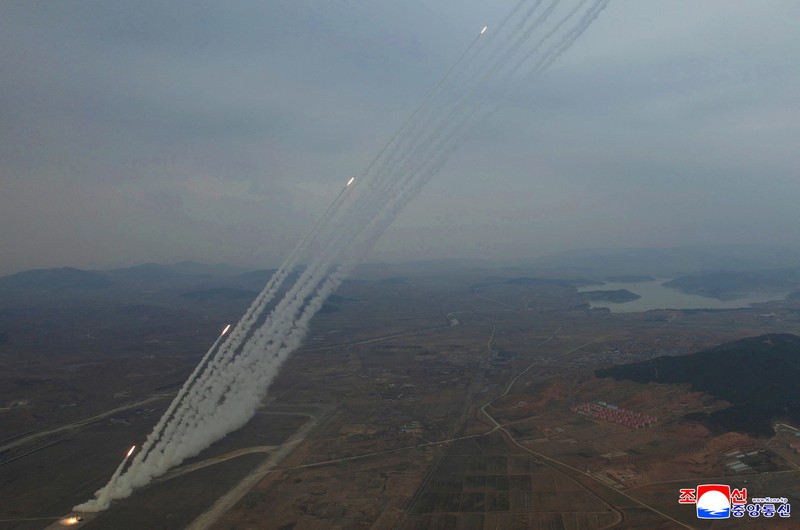 North Korean leader Kim Jong Un, accompanied by his daughter Kim Ju Ae, oversees the test-launch of 600 mm-calibre multiple rocket launchers, North Korea, March 14, 2026, in this picture released by North Korea's official Korean Central News Agency.  KCNA via REUTERS    ATTENTION EDITORS - THIS IMAGE WAS PROVIDED BY A THIRD PARTY. REUTERS IS UNABLE TO INDEPENDENTLY VERIFY THIS IMAGE. NO THIRD PARTY SALES. SOUTH KOREA OUT. NO COMMERCIAL OR EDITORIAL SALES IN SOUTH KOREA.