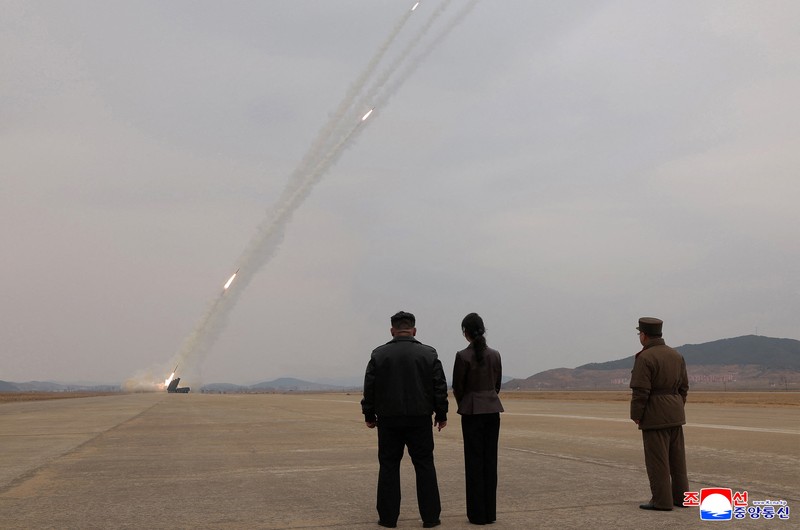 North Korean leader Kim Jong Un, accompanied by his daughter Kim Ju Ae, oversees the test-launch of 600 mm-calibre multiple rocket launchers, North Korea, March 14, 2026, in this picture released by North Korea's official Korean Central News Agency.  KCNA via REUTERS    ATTENTION EDITORS - THIS IMAGE WAS PROVIDED BY A THIRD PARTY. REUTERS IS UNABLE TO INDEPENDENTLY VERIFY THIS IMAGE. NO THIRD PARTY SALES. SOUTH KOREA OUT. NO COMMERCIAL OR EDITORIAL SALES IN SOUTH KOREA.