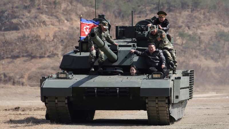 North Korean leader Kim Jong Un and his daughter Kim Ju Ae ride a tank during what North Korean state news agency KCNA reports is an offensive tactical drill involving a new type of tank, at a training base in Pyongyang, North Korea, March 19, 2026, in this picture released by North Korea's official Korean Central News Agency. KCNA via REUTERS ATTENTION EDITORS - THIS IMAGE WAS PROVIDED BY A THIRD PARTY. REUTERS IS UNABLE TO INDEPENDENTLY VERIFY THIS IMAGE. NO THIRD PARTY SALES. SOUTH KOREA OUT. NO COMMERCIAL OR EDITORIAL SALES IN SOUTH KOREA.     TPX IMAGES OF THE DAY