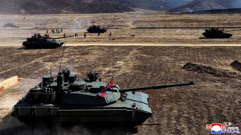 North Korean leader Kim Jong Un and his daughter Kim Ju Ae ride a tank during what North Korean state news agency KCNA reports is an offensive tactical drill involving a new type of tank, at a training base in Pyongyang, North Korea, March 19, 2026, in this picture released by North Korea's official Korean Central News Agency. KCNA via REUTERS ATTENTION EDITORS - THIS IMAGE WAS PROVIDED BY A THIRD PARTY. REUTERS IS UNABLE TO INDEPENDENTLY VERIFY THIS IMAGE. NO THIRD PARTY SALES. SOUTH KOREA OUT. NO COMMERCIAL OR EDITORIAL SALES IN SOUTH KOREA.     TPX IMAGES OF THE DAY