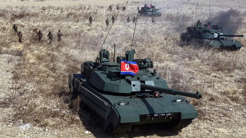 North Korean leader Kim Jong Un and his daughter Kim Ju Ae ride a tank during what North Korean state news agency KCNA reports is an offensive tactical drill involving a new type of tank, at a training base in Pyongyang, North Korea, March 19, 2026, in this picture released by North Korea's official Korean Central News Agency. KCNA via REUTERS ATTENTION EDITORS - THIS IMAGE WAS PROVIDED BY A THIRD PARTY. REUTERS IS UNABLE TO INDEPENDENTLY VERIFY THIS IMAGE. NO THIRD PARTY SALES. SOUTH KOREA OUT. NO COMMERCIAL OR EDITORIAL SALES IN SOUTH KOREA.     TPX IMAGES OF THE DAY