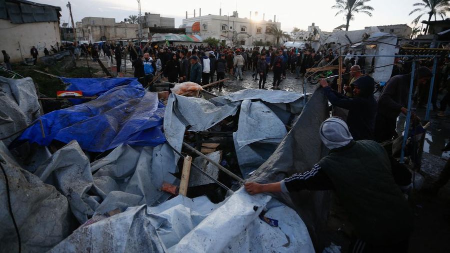 Smoke and flames rise following an Israeli strike near a tent camp sheltering displaced Palestinians in Deir al-Balah, central Gaza Strip, March 25, 2026. The Israeli military ordered camp to evacuate before the strike, according to residents. REUTERS/Stringer