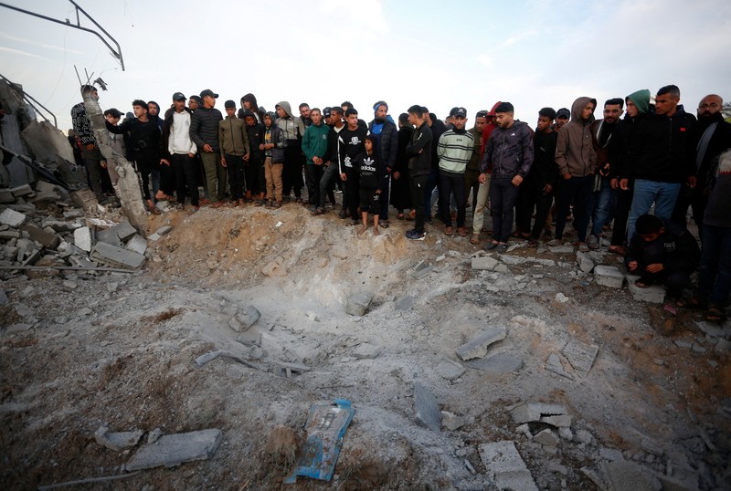 Smoke and flames rise following an Israeli strike near a tent camp sheltering displaced Palestinians in Deir al-Balah, central Gaza Strip, March 25, 2026. The Israeli military ordered camp to evacuate before the strike, according to residents. REUTERS/Stringer