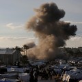 Smoke rises following an Israeli strike near a tent camp sheltering displaced Palestinians in Deir al-Balah, central Gaza Strip, March 25, 2026. The Israeli military ordered camp to evacuate before the strike, according to residents. REUTERS/Stringer