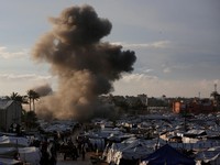 Smoke rises following an Israeli strike near a tent camp sheltering displaced Palestinians in Deir al-Balah, central Gaza Strip, March 25, 2026. The Israeli military ordered camp to evacuate before the strike, according to residents. REUTERS/Stringer