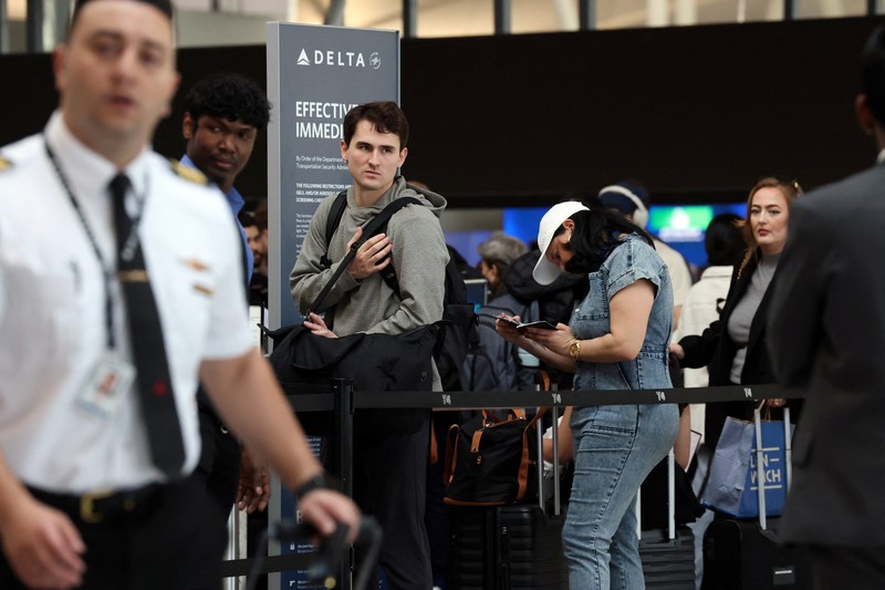 People wait in TSA security lines at New York's John F. Kennedy International Airport in Queens, New York City, U.S., March 26, 2026. Picture taken with a phone. REUTERS/Brendan McDermid