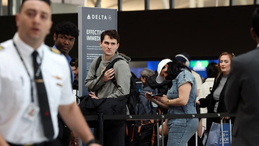 People wait in TSA security lines at New York's John F. Kennedy International Airport in Queens, New York City, U.S., March 26, 2026. Picture taken with a phone. REUTERS/Brendan McDermid