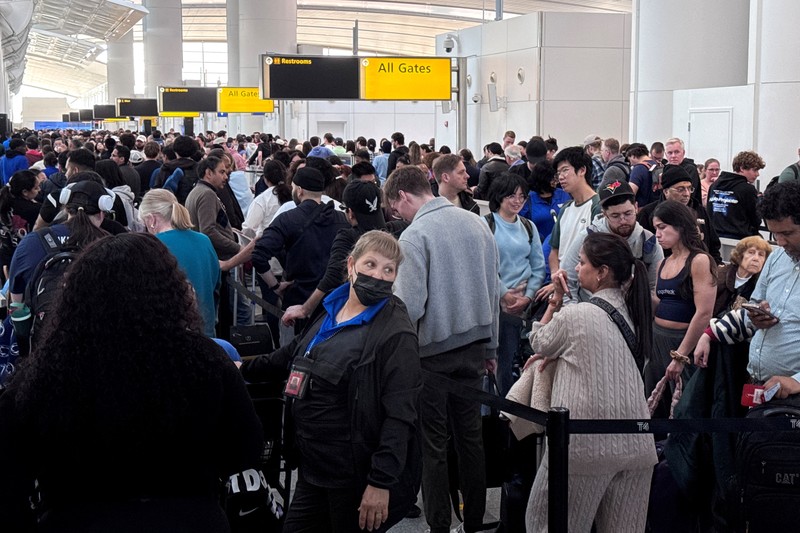 People wait in TSA security lines at New York's John F. Kennedy International Airport in Queens, New York City, U.S., March 26, 2026. Picture taken with a phone. REUTERS/Brendan McDermid