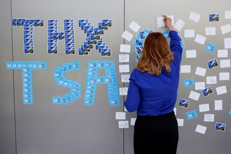 People wait in TSA security lines at New York's John F. Kennedy International Airport in Queens, New York City, U.S., March 26, 2026. Picture taken with a phone. REUTERS/Brendan McDermid