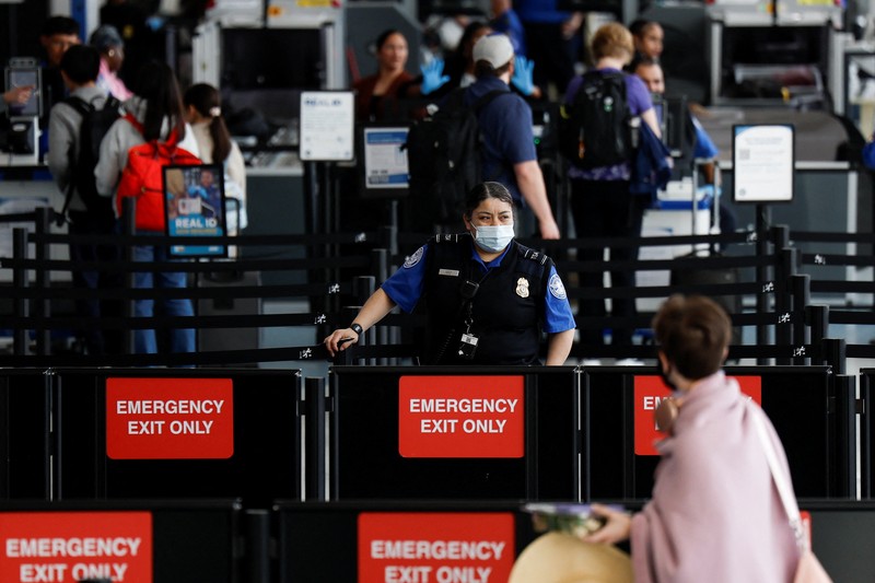 People wait in TSA security lines at New York's John F. Kennedy International Airport in Queens, New York City, U.S., March 26, 2026. Picture taken with a phone. REUTERS/Brendan McDermid