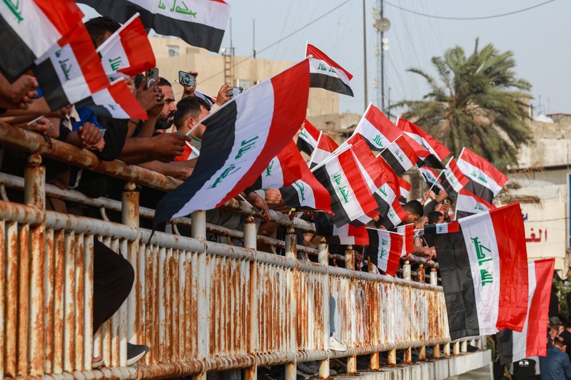 Pendukung ulama Syiah Irak, Muqtada al-Sadr, berpartisipasi dalam protes damai menentang tindakan AS dan Israel di Baghdad, Irak Sabtu (4/4/2026).(REUTERS/Ahmed Saad)