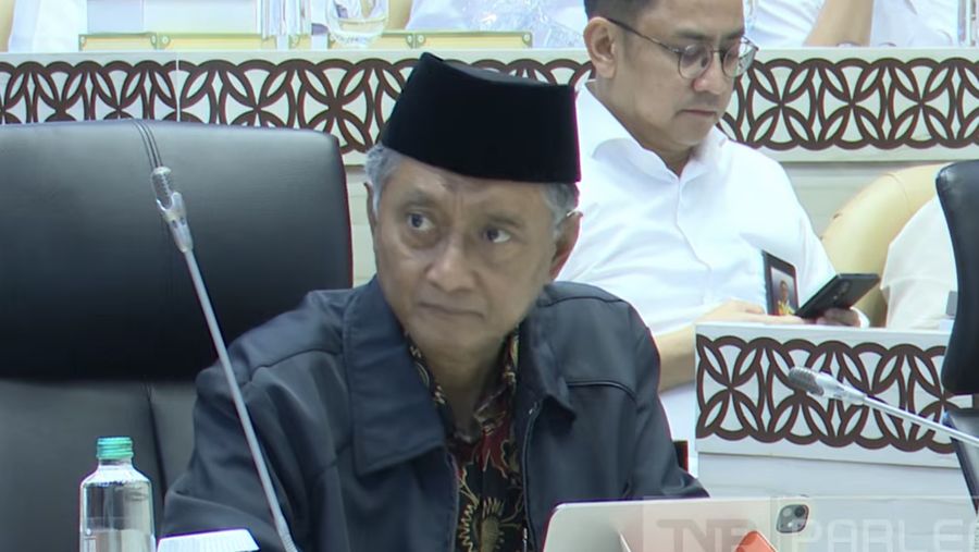 Menteri Pekerjaan Umum (PU) Dody Hanggodo saat mengikuti rapat dengan Komisi V DPR RI di Gedung DPR/MPR, Jakarta, Selasa (7/4/2026). (Tangkapan Layar Youtube/DPR RI)