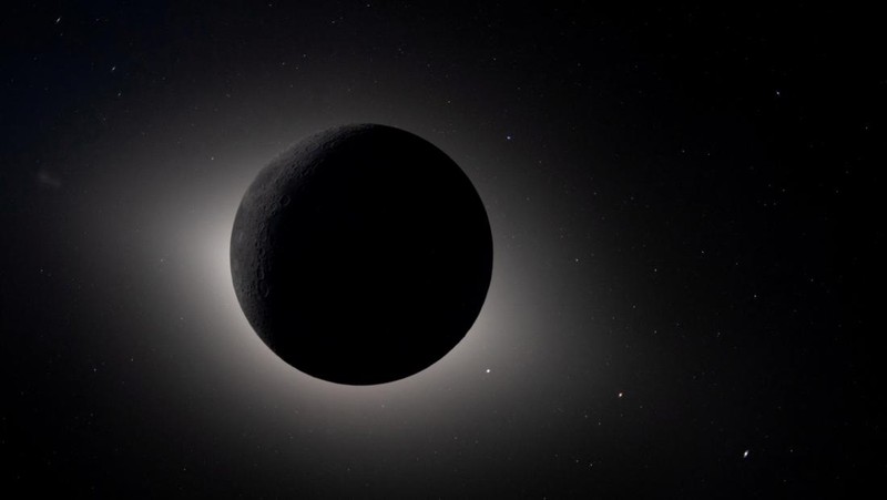 Pemandangan Bumi, yang sebagian tertutup oleh Bulan, difoto melalui jendela pesawat ruang angkasa Orion pada pukul 18.41 EDT (22.41 GMT) tanggal 6 April 2026, selama penerbangan lintas Bulan oleh awak Artemis II. (NASA/Handout via REUTERS)