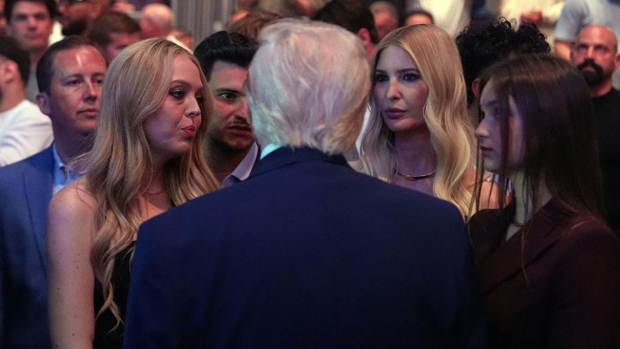 U.S. President Donald Trump and Hunter Campbell, chief business officer of the UFC, watch a match during the UFC 327 event at Kaseya Center in Miami, Florida, U.S., April 11, 2026.  REUTERS/Kevin Lamarque