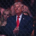 Apr 11, 2026; Miami, Florida, UNITED STATES;  President of the United States Donald Trump reacts after the fight between Cub Swanson (red gloves) and Nate Landwehr (blue gloves) during UFC 327 at Kaseya Center. Mandatory Credit: Sam Navarro-Imagn Ima