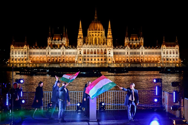 Peter Magyar, leader of the opposition Tisza party, and other officials celebrate following the partial results of the parliamentary election, in Budapest, Hungary, April 12, 2026. REUTERS/Marton Monus     TPX IMAGES OF THE DAY