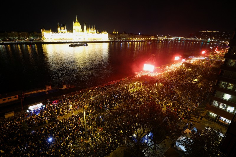 Peter Magyar, leader of the opposition Tisza party, and other officials celebrate following the partial results of the parliamentary election, in Budapest, Hungary, April 12, 2026. REUTERS/Marton Monus     TPX IMAGES OF THE DAY