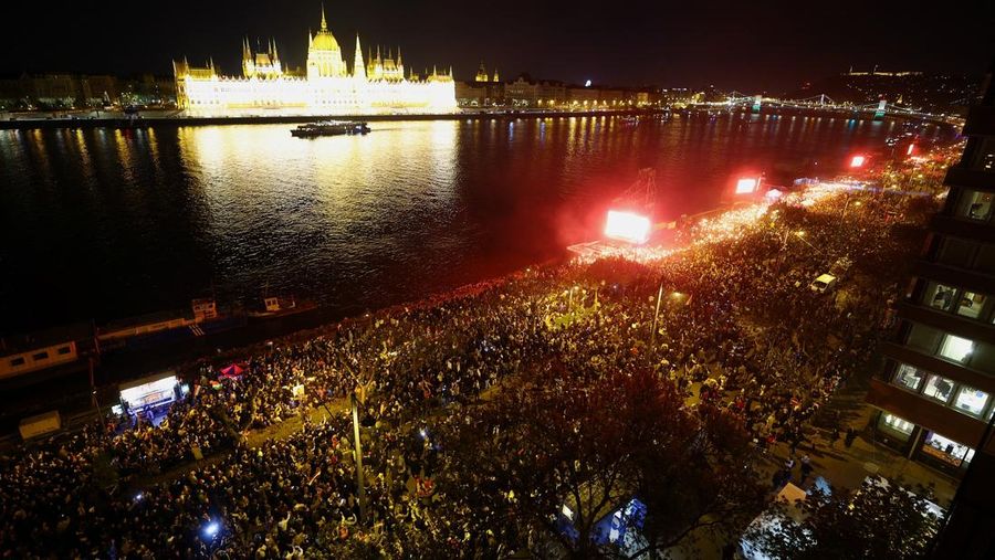 Peter Magyar, leader of the opposition Tisza party, and other officials celebrate following the partial results of the parliamentary election, in Budapest, Hungary, April 12, 2026. REUTERS/Marton Monus     TPX IMAGES OF THE DAY