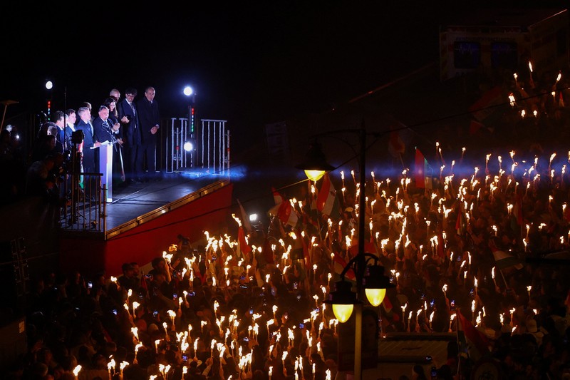 Peter Magyar, leader of the opposition Tisza party, and other officials celebrate following the partial results of the parliamentary election, in Budapest, Hungary, April 12, 2026. REUTERS/Marton Monus     TPX IMAGES OF THE DAY