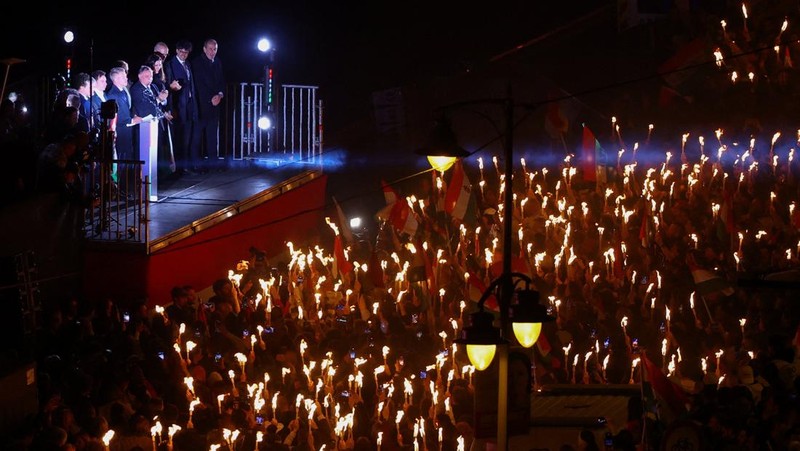 Peter Magyar, leader of the opposition Tisza party, and other officials celebrate following the partial results of the parliamentary election, in Budapest, Hungary, April 12, 2026. REUTERS/Marton Monus     TPX IMAGES OF THE DAY