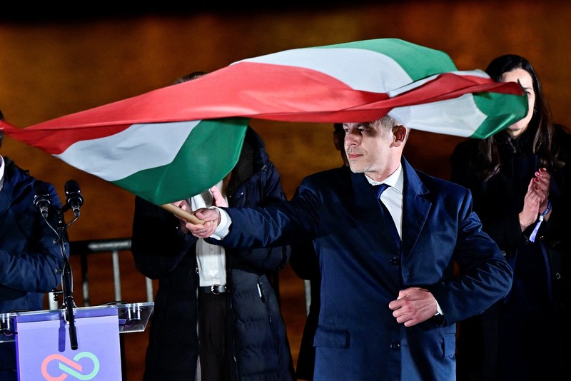 Peter Magyar, leader of the opposition Tisza party, and other officials celebrate following the partial results of the parliamentary election, in Budapest, Hungary, April 12, 2026. REUTERS/Marton Monus     TPX IMAGES OF THE DAY