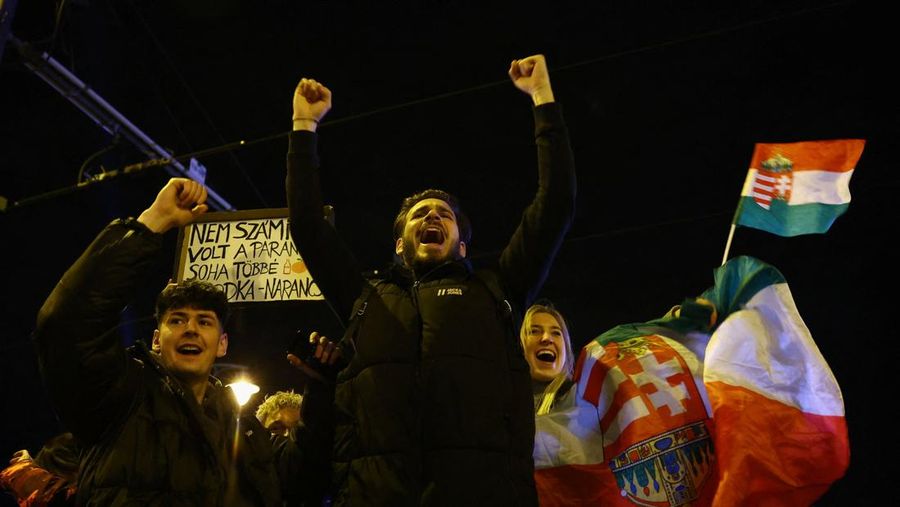 Peter Magyar, leader of the opposition Tisza party, and other officials celebrate following the partial results of the parliamentary election, in Budapest, Hungary, April 12, 2026. REUTERS/Marton Monus     TPX IMAGES OF THE DAY