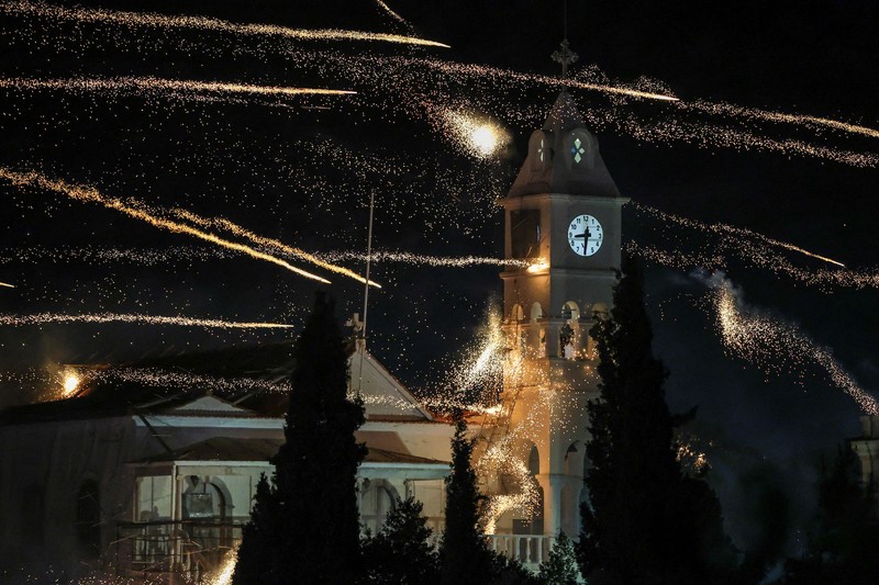 A man ignites handmade rockets during Greek Orthodox Easter celebrations in the village of Vrontados, on the island of Chios, Greece, April 11, 2026. REUTERS/Konstantinos Anagnostou