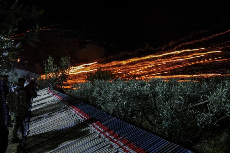 A man ignites handmade rockets during Greek Orthodox Easter celebrations in the village of Vrontados, on the island of Chios, Greece, April 11, 2026. REUTERS/Konstantinos Anagnostou