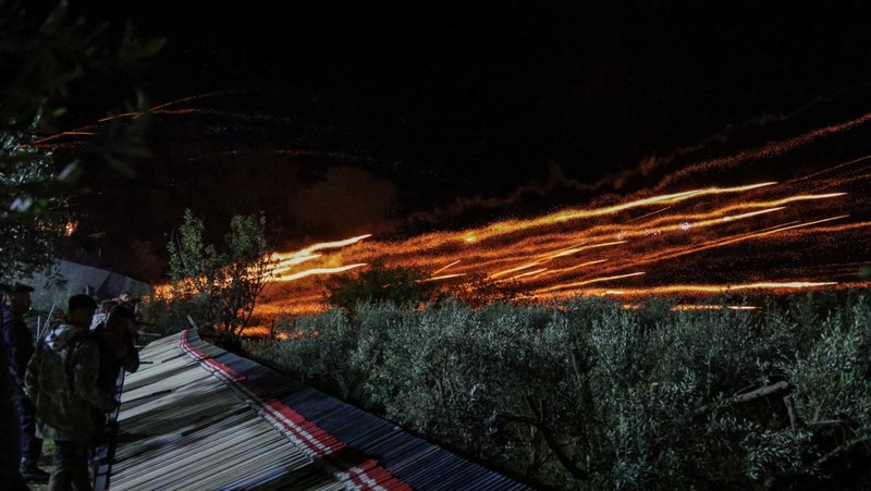 A man ignites handmade rockets during Greek Orthodox Easter celebrations in the village of Vrontados, on the island of Chios, Greece, April 11, 2026. REUTERS/Konstantinos Anagnostou