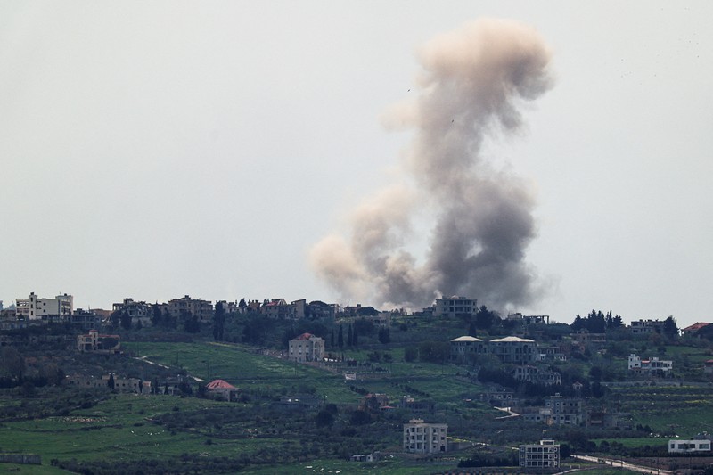 An Israeli helicopter releases flares, near the Israel-Lebanon border, as seen from the Israeli side of the border in northern Israel, April 14, 2026. REUTERS/Florion Goga REFILE - QUALITY REPEAT     TPX IMAGES OF THE DAY