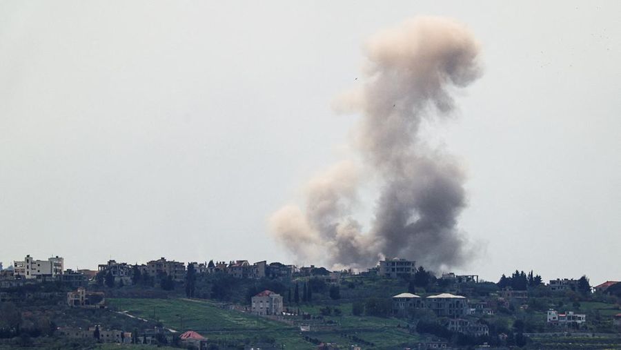 An Israeli helicopter releases flares, near the Israel-Lebanon border, as seen from the Israeli side of the border in northern Israel, April 14, 2026. REUTERS/Florion Goga REFILE - QUALITY REPEAT     TPX IMAGES OF THE DAY