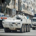 A UNIFIL convoy rides through the town, as seen through the window of a vehicle, in Tyre, south Lebanon, April 15, 2026. REUTERS/Louisa Gouliamaki
