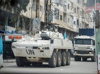 A UNIFIL convoy rides through the town, as seen through the window of a vehicle, in Tyre, south Lebanon, April 15, 2026. REUTERS/Louisa Gouliamaki