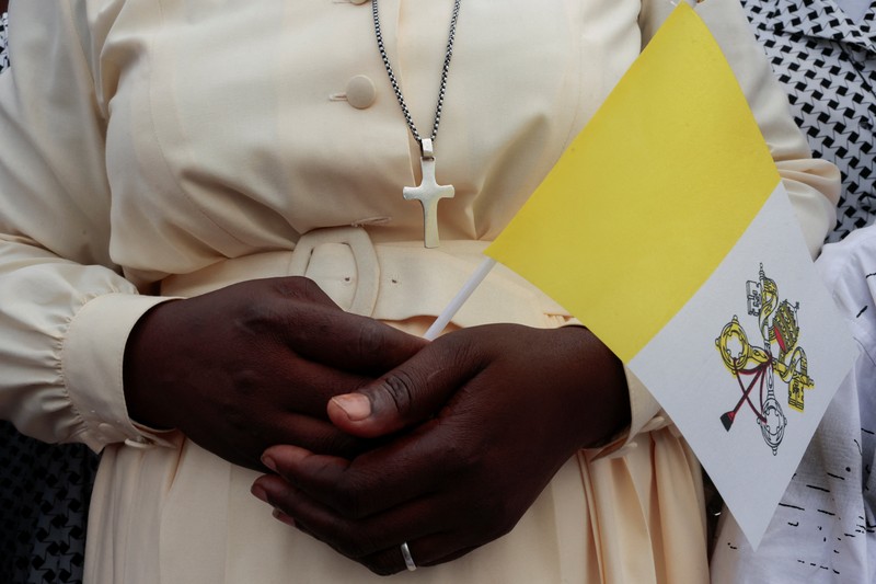 Pope Leo XIV waves as he boards a plane bound for Bamenda where he will attend a meeting for peace and hold a holy Mass, at Yaounde Nsimalen International Airport, in Yaounde, Cameroon, April 16, 2026. REUTERS/Luc Gnago