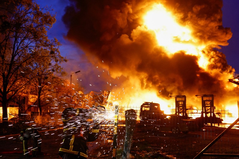 Firefighters work at the site of a recyclable materials warehouse hit by a Russian missile strike, amid Russia's attack on Ukraine, in Kyiv, Ukraine April 16, 2026. REUTERS/Valentyn Ogirenko
