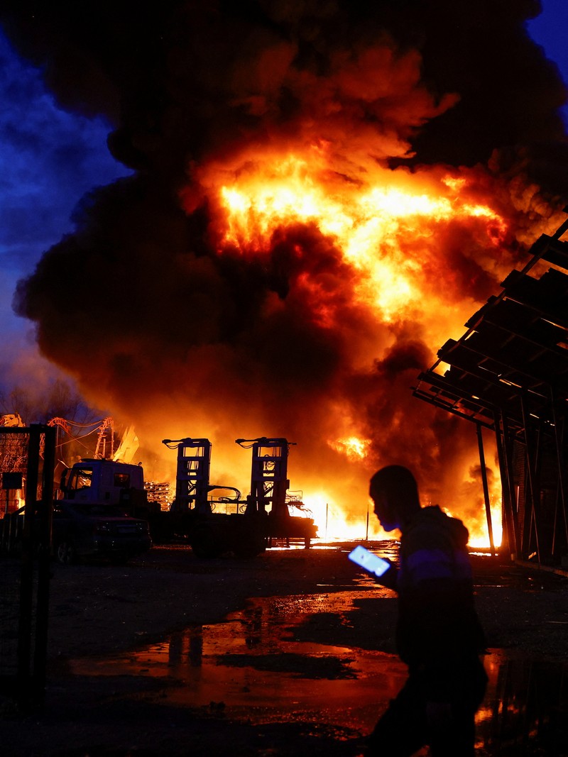 Firefighters work at the site of a recyclable materials warehouse hit by a Russian missile strike, amid Russia's attack on Ukraine, in Kyiv, Ukraine April 16, 2026. REUTERS/Valentyn Ogirenko