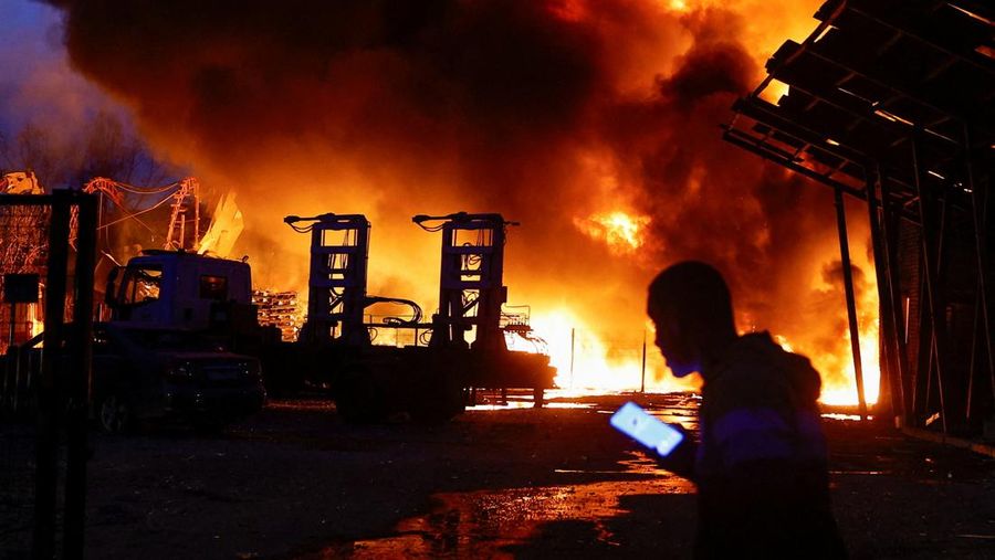 Firefighters work at the site of a recyclable materials warehouse hit by a Russian missile strike, amid Russia's attack on Ukraine, in Kyiv, Ukraine April 16, 2026. REUTERS/Valentyn Ogirenko