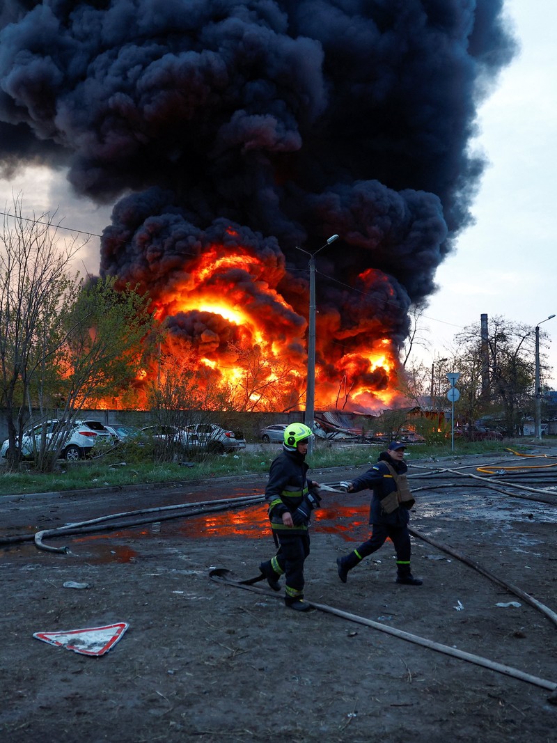 Firefighters work at the site of a recyclable materials warehouse hit by a Russian missile strike, amid Russia's attack on Ukraine, in Kyiv, Ukraine April 16, 2026. REUTERS/Valentyn Ogirenko