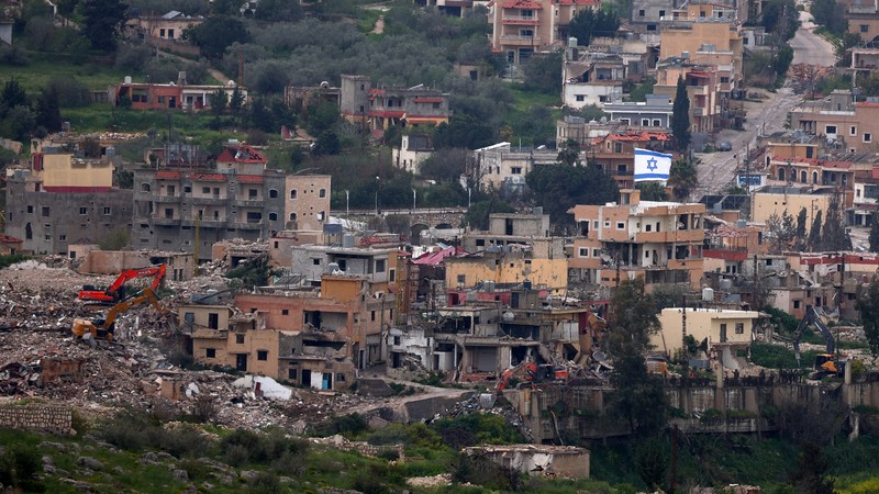 People gather at the site of an Israeli strike carried out before a 10-day ceasefire between Lebanon and Israel went into effect, in Tyre, Lebanon, April 17, 2026. REUTERS/Louisa Gouliamaki