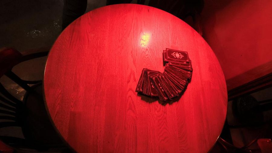 Fortune teller Arina Frants lays out Tarot cards on a table in the voodoo-themed bar Marie Laveau in Moscow, Russia February 17, 2026. REUTERS/Shamil Zhumatov