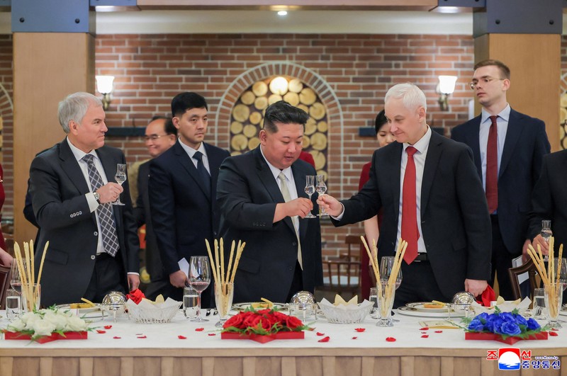 North Korean leader Kim Jong Un, Russia's Defence Minister Andrey Belousov and Russia's State Duma Chairman Vyacheslav Volodin raise a toast during a banquet hosted for the Russian delegate visiting North Korea to attend the opening ceremony of the Memorial Museum of Combat Feats at the Overseas Military Operations honouring North Korean troops killed while fighting for Russia in the war against Ukraine, in Pyongyang, North Korea, April 26, 2026, in this picture released by North Korea's official Korean Central News Agency. KCNA via REUTERS    ATTENTION EDITORS - THIS IMAGE WAS PROVIDED BY A THIRD PARTY. REUTERS IS UNABLE TO INDEPENDENTLY VERIFY THIS IMAGE. NO THIRD PARTY SALES. SOUTH KOREA OUT. NO COMMERCIAL OR EDITORIAL SALES IN SOUTH KOREA.
