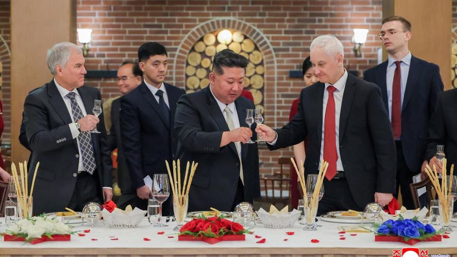 North Korean leader Kim Jong Un, Russia's Defence Minister Andrey Belousov and Russia's State Duma Chairman Vyacheslav Volodin raise a toast during a banquet hosted for the Russian delegate visiting North Korea to attend the opening ceremony of the M