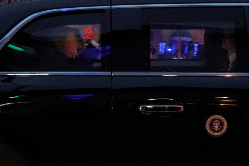 An FBI member stands outside a building next to the house associated with Cole Tomas Allen, the suspect in the shooting incident in Washington at the annual White House Correspondents' Association dinner, in Torrance, California, U.S., April 26, 2026.  REUTERS/David Swanson