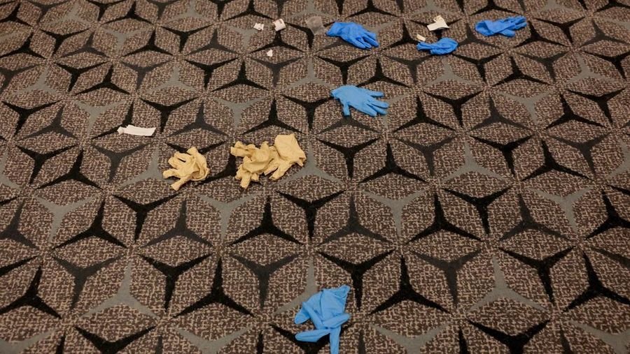 Gloves lie on the floor near the ballroom at the Washington Hilton hotel, where a shooting incident occurred yesterday night at the annual White House Correspondents' Association dinner, in Washington, D.C., U.S., April 26, 2026. REUTERS/Kylie Cooper